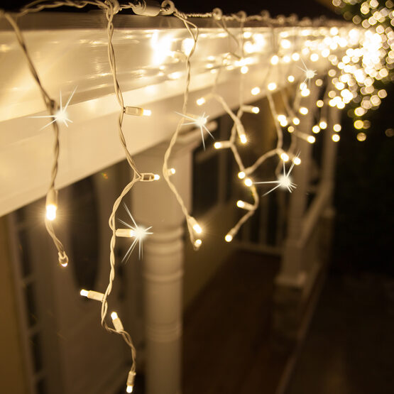 70 5mm LED Icicle Lights, Warm White Twinkle, White Wire